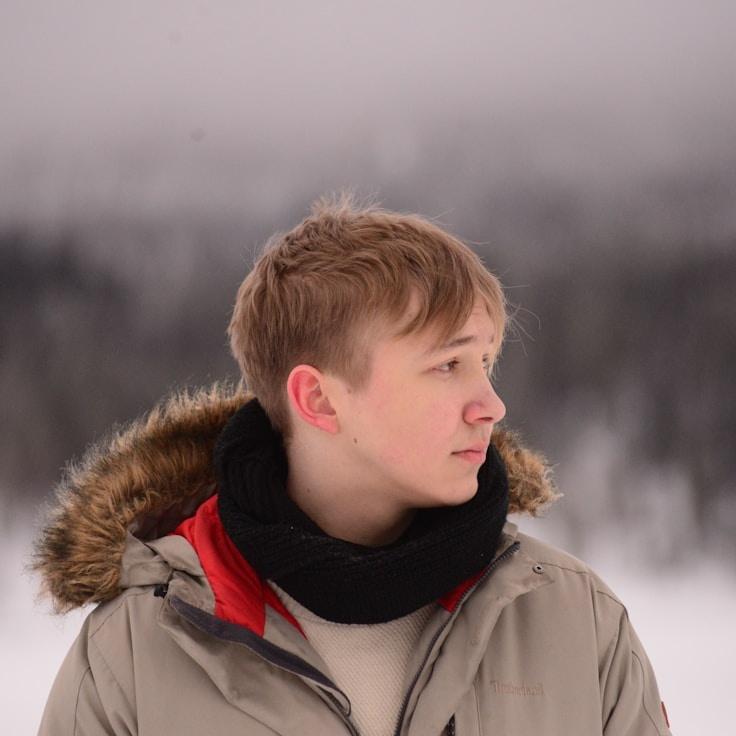 Nova Shah, Lead Design Curator at Golden Horizon Center, reviewing corporate floral arrangements